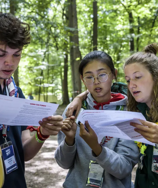 Three Scouts read maps